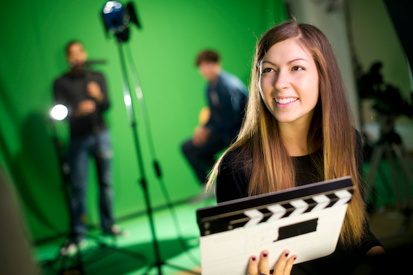 media student in college tv studio