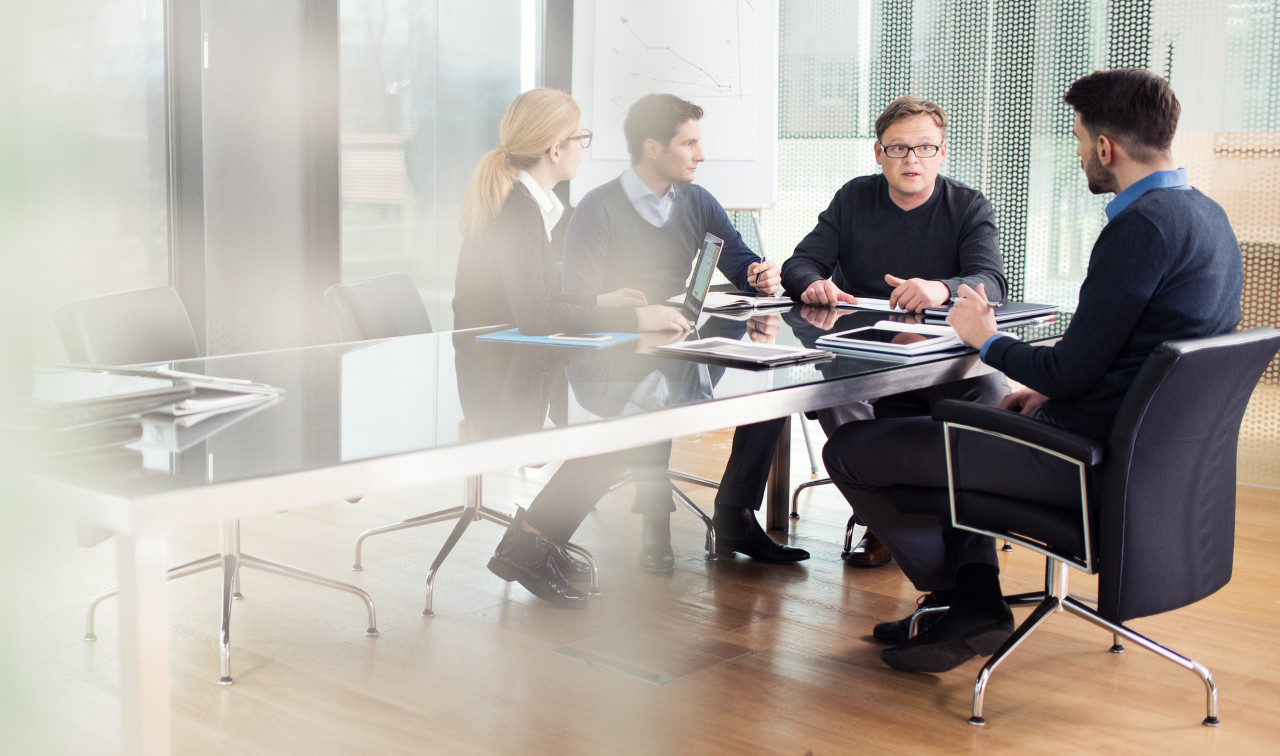 Group of people working at a desk