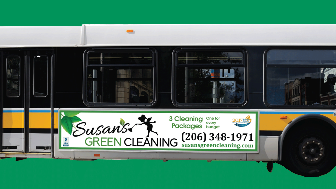 Bus with an ad for a cleaning company on the side.